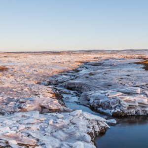 Broken Ice on the Dykes at Sunset